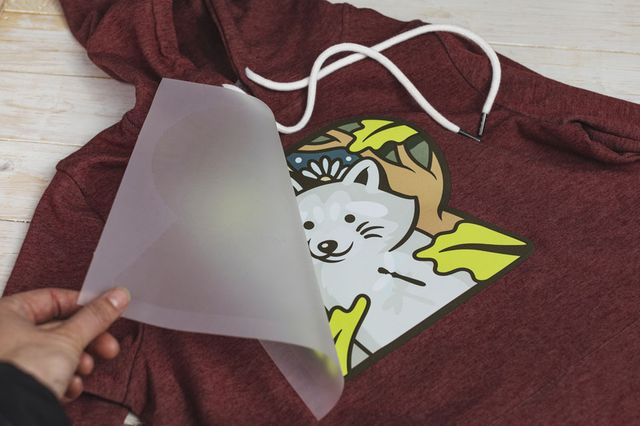 custom DTF transfer being applied to a hoodie