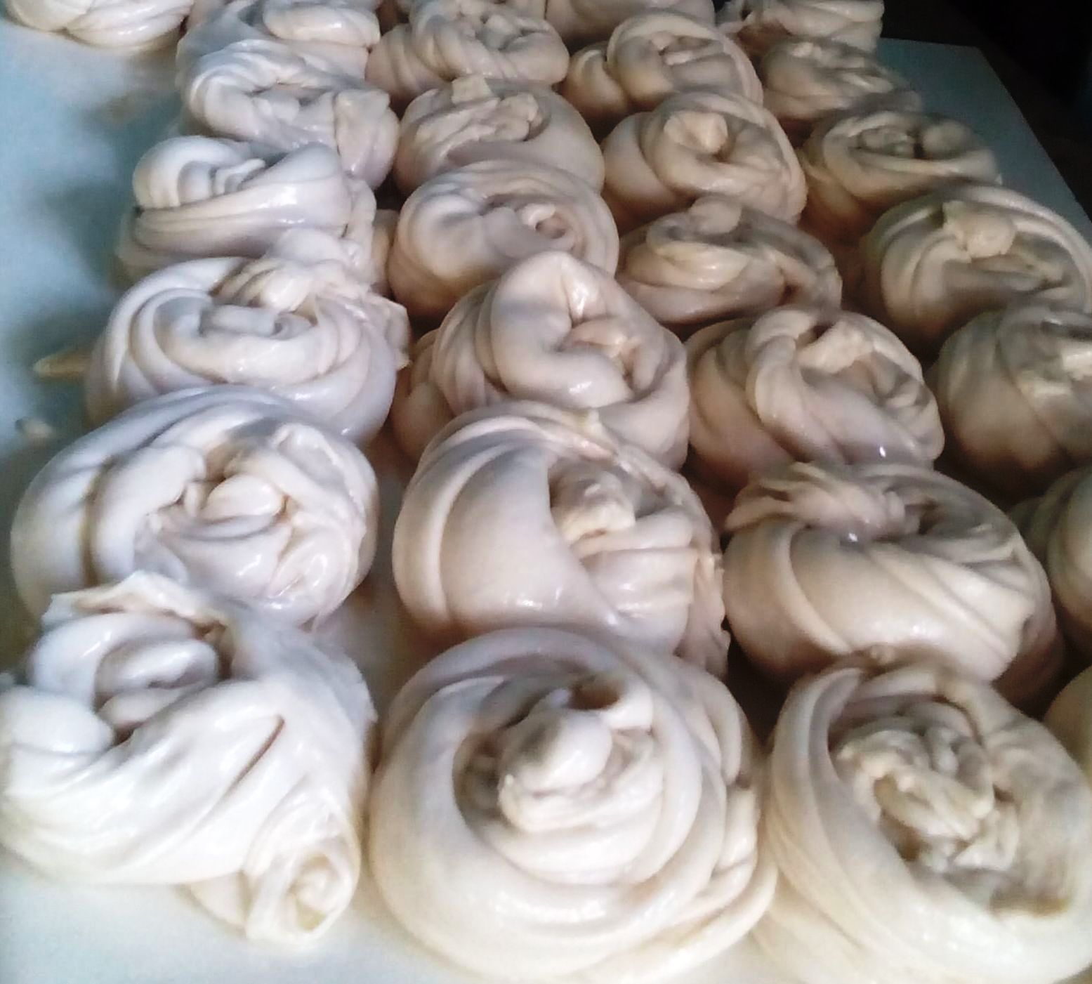 Several balls of coiled dough, showing complex layers.
