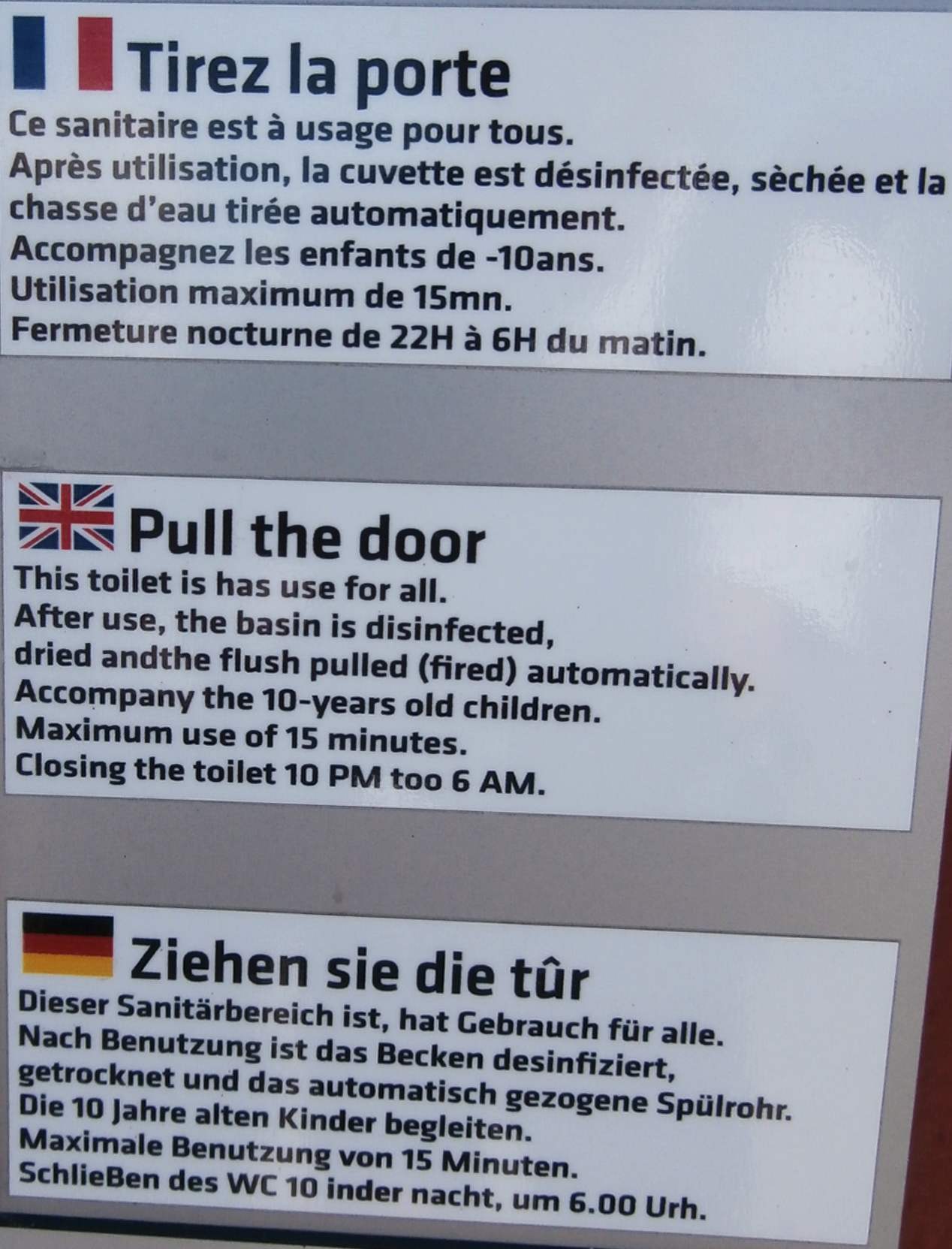Public restroom sign with broken English and German directly translated from French.