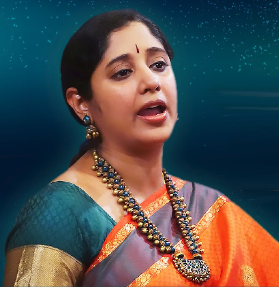 Nisha Rajagopal singing in a concert