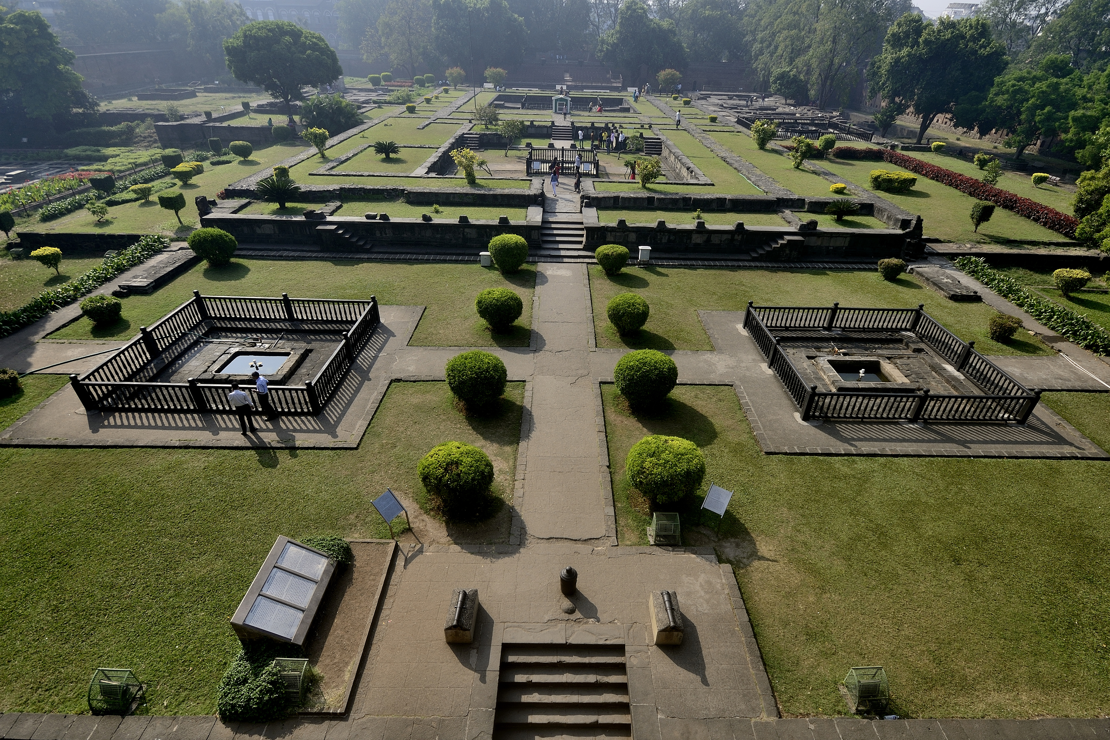 The Gardens of Shaniwar Wada are seen. The foundations of many structures as well as fountains are also present.