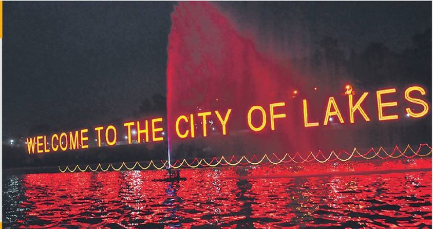 An electric illuminated sign saying "Welcome To City Of Lakes" in December 2015