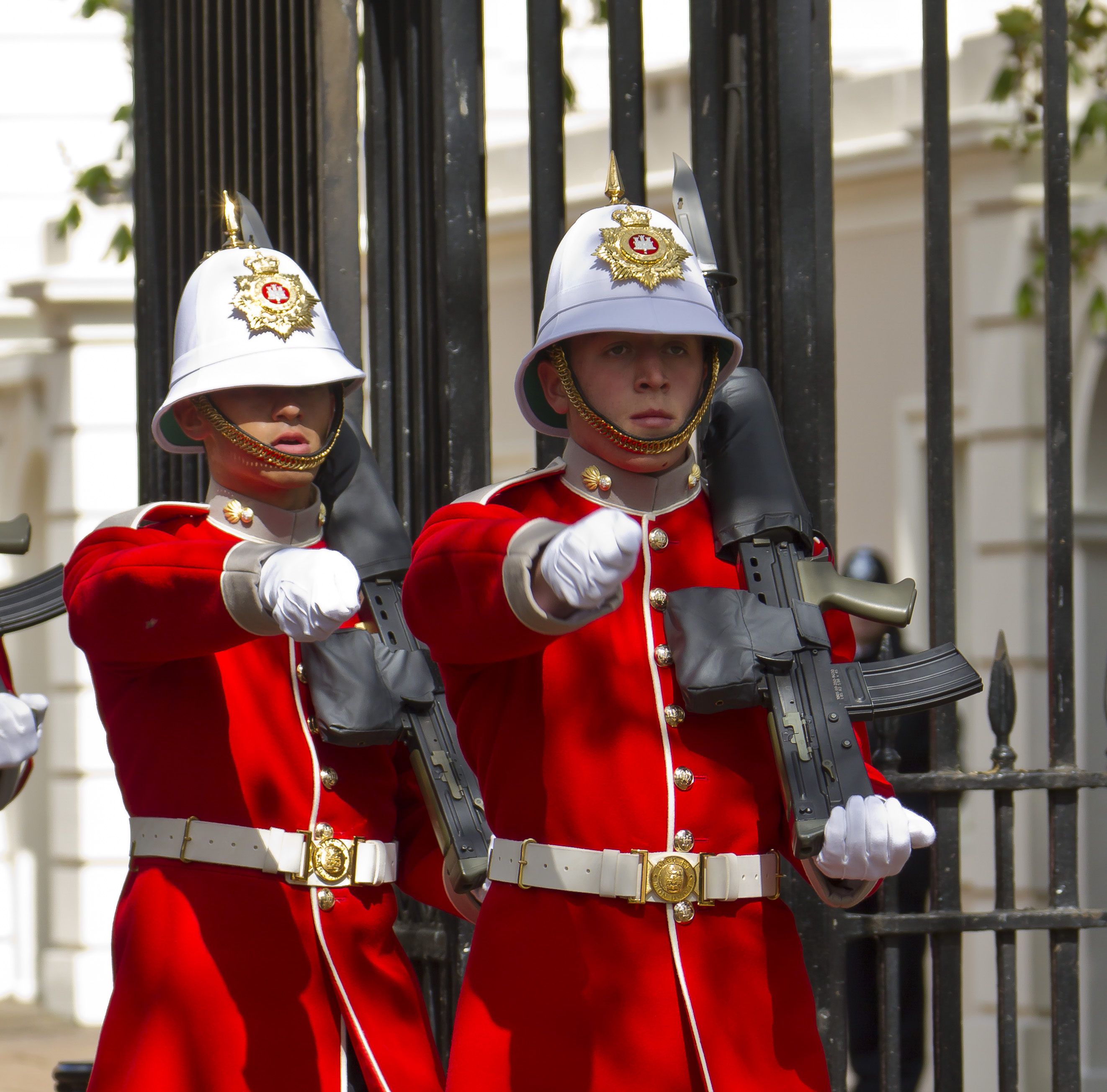Two soldiers in red dress uniforms