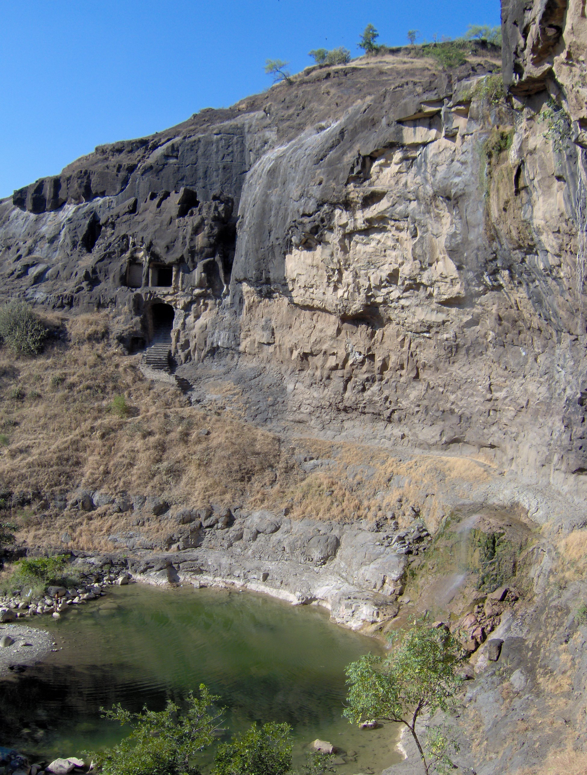 A temple pond and waterfall at Ellora Caves in Maharashtra