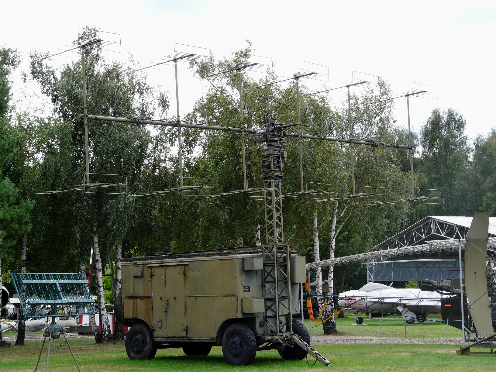 NRS-12 "Score Board" IFF radar (bottom left - mounted on tri-pod) and P-12 "Spoon Rest" (centre - mounted on a towable generator).