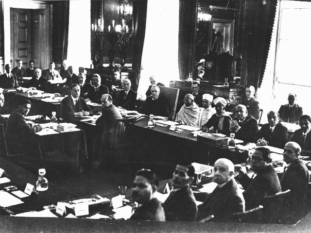British prime minister, Ramsay MacDonald, three places to the right of Gandhi (to the viewer's left) at the 2nd Round Table Conference. Samuel Hoare is two places to Gandhi's right. Foreground, fourth from left, is B. R. Ambedkar representing the "Depressed Classes"