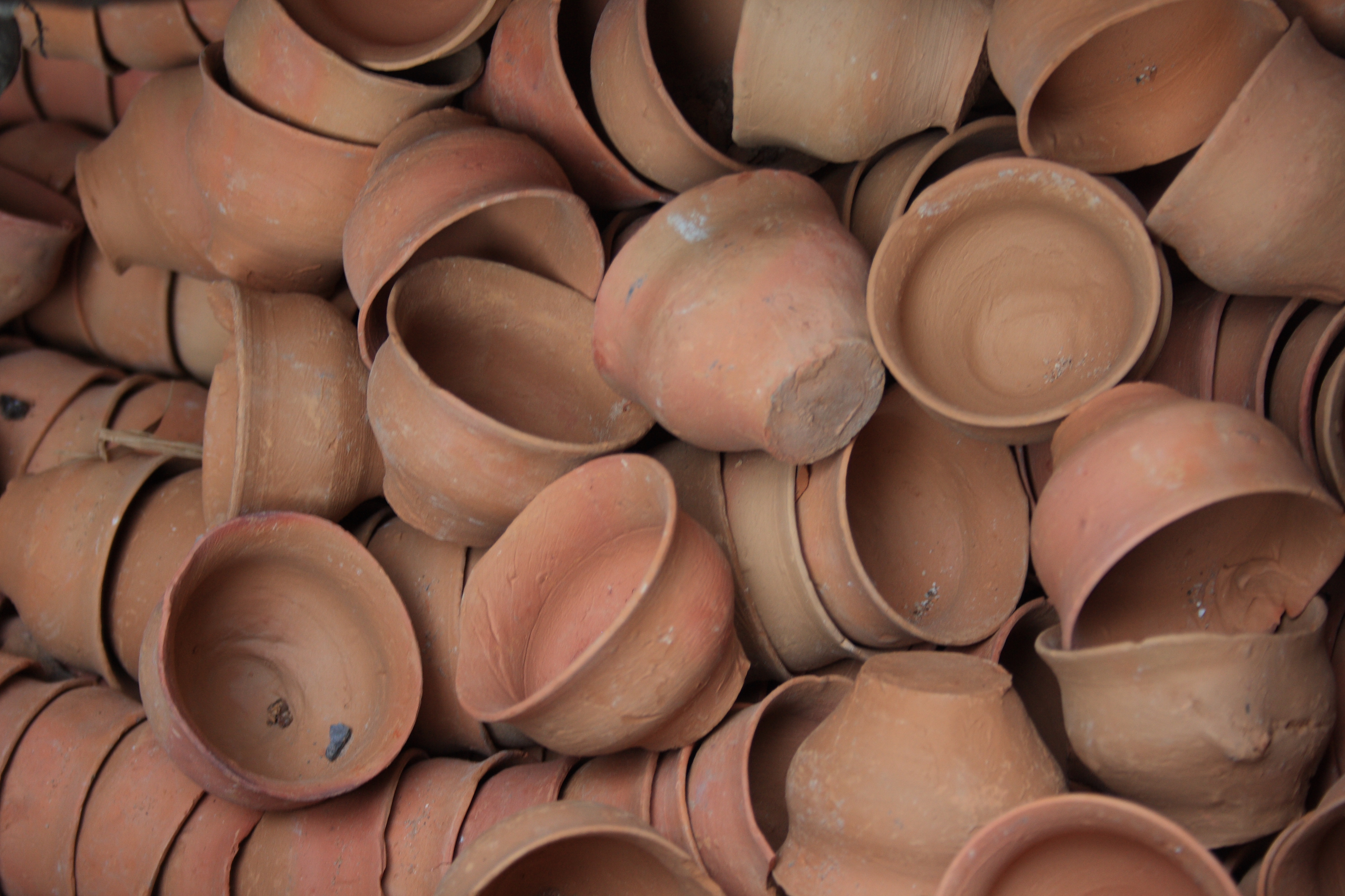 Indian red clay teacups, unglazed, are used by some vendors.