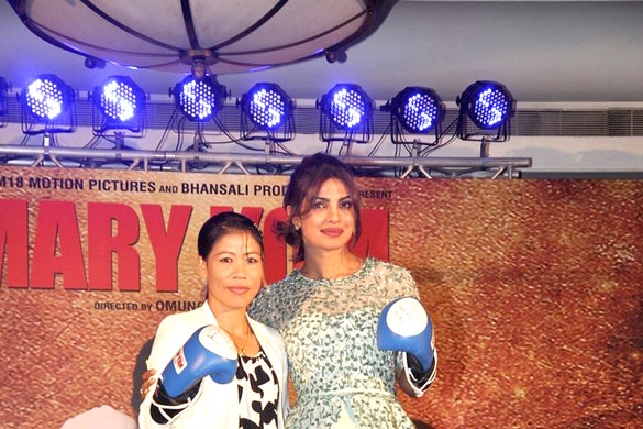 A photograph of Mary Kom and Priyanka Chopra looking forward, smiling and posing for the camera