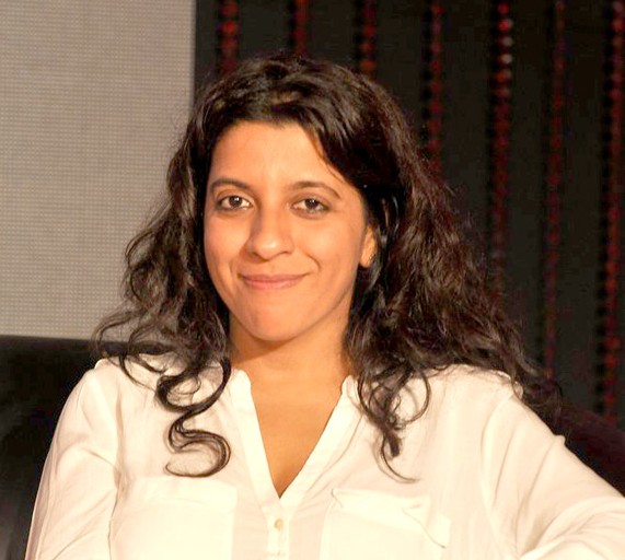 A photograph of Zoya Akhtar smiling, looking towards the camera