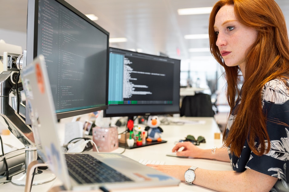 Red-haired woman coding - Photo by ThisisEngineering RAEng on Unsplash