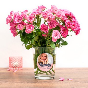 Bouquet of pink roses in a vase with personalised sticker