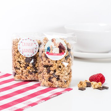 Small plastic bags with granola and personalised stickers