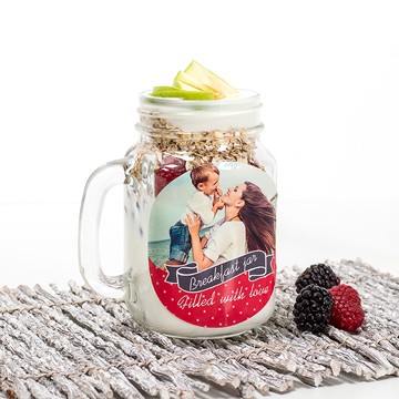 Jar with yoghurt, berries and oatmeal with personalised sticker for mother