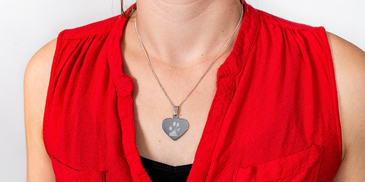 Heart pendant with footprint of dog engraved