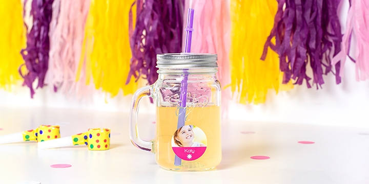 Mason jar filled with lemonade and kids sticker on it