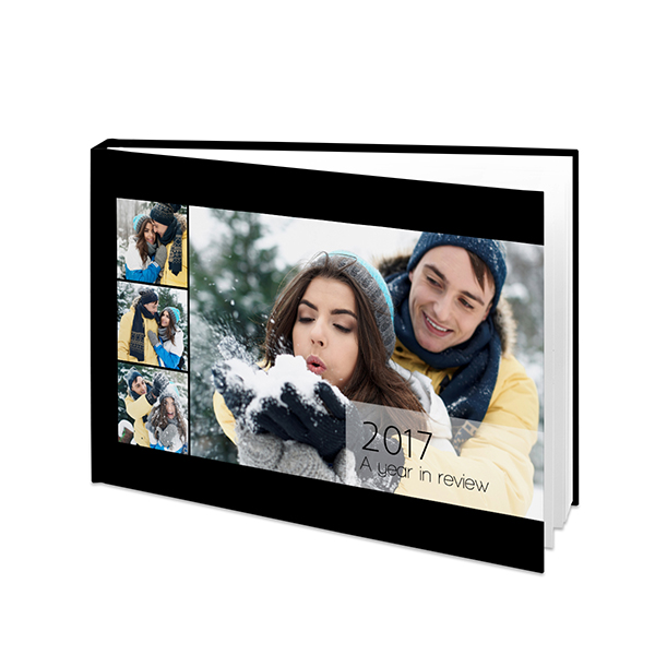 Livre photo annuel - couverture solide noire avec photos.