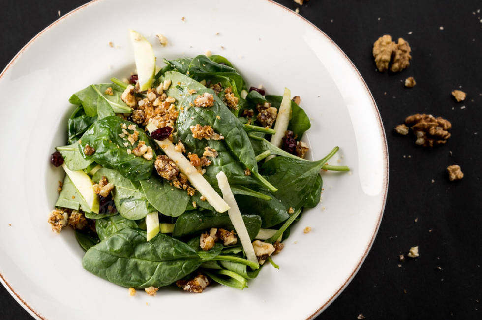 Baby spinach, apples, blueberries, caramelized walnuts photo