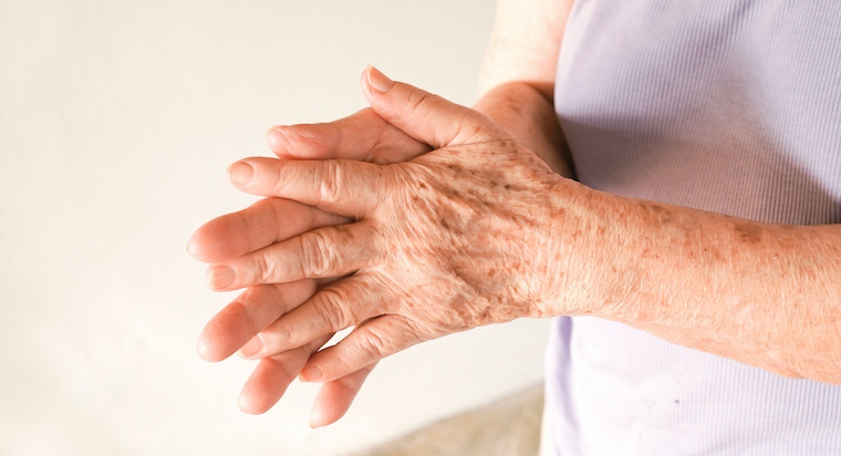 a close-up of a man and a woman holding hands