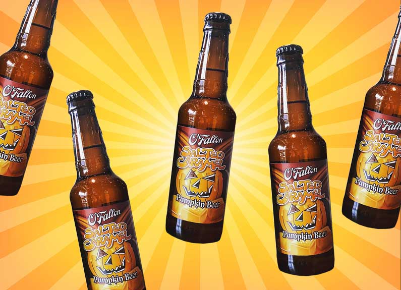 bottles of o'fallon salted caramel pumpkin ale on an orange and yellow striped background