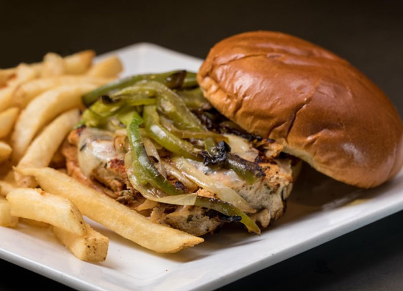 an open-faced grilled chicken sandwich 