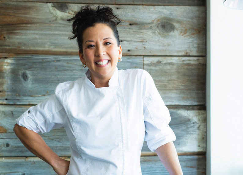 a woman in a white chef coat