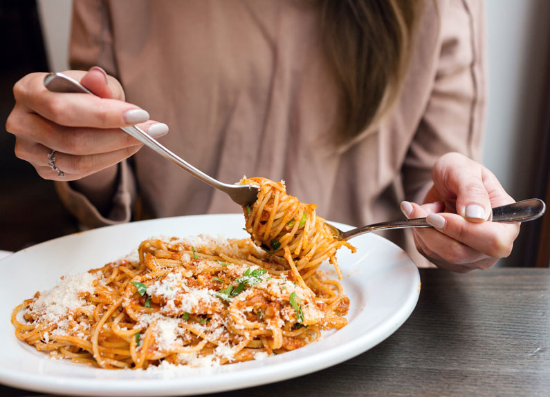 person twirling spaghetti