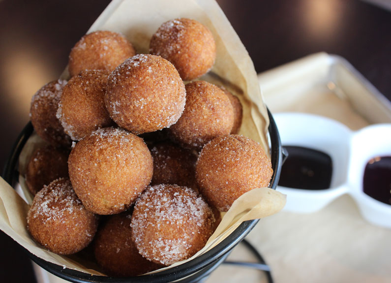 a basket of cinnamon sugar doughnut balls at edgewild in edwardsville