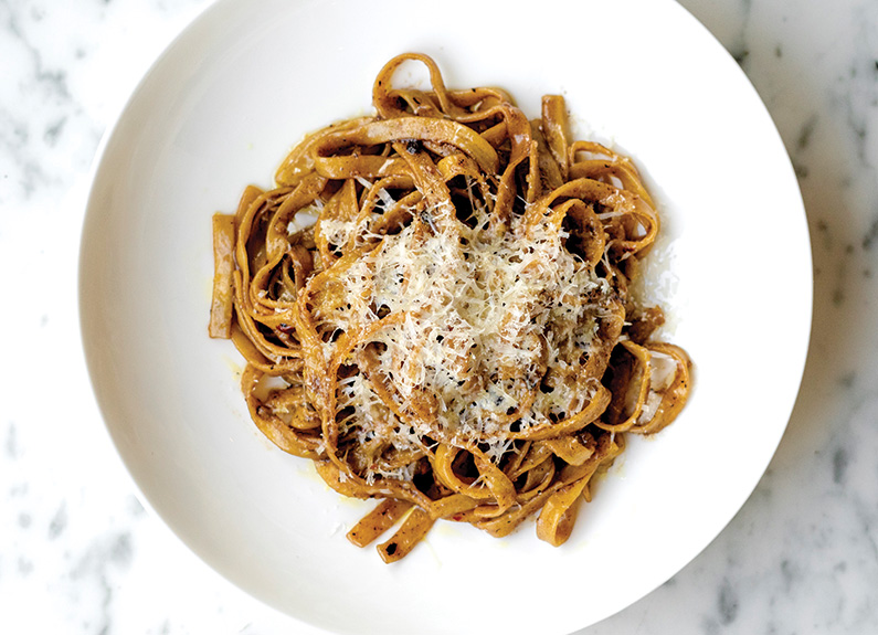 a bowl of pasta on a white plate