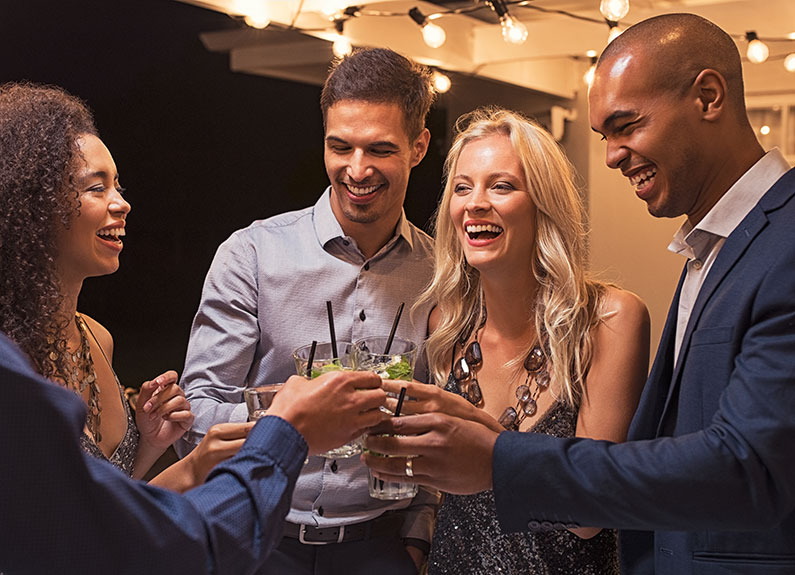 smiling people sharing drinks