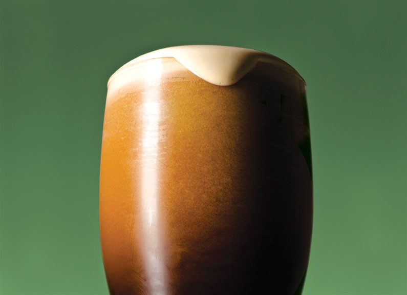 a nitro irish stout on a green background