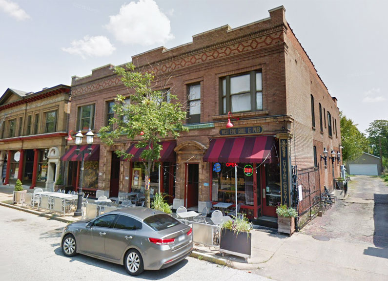 the red brick exterior of west end grill and pub