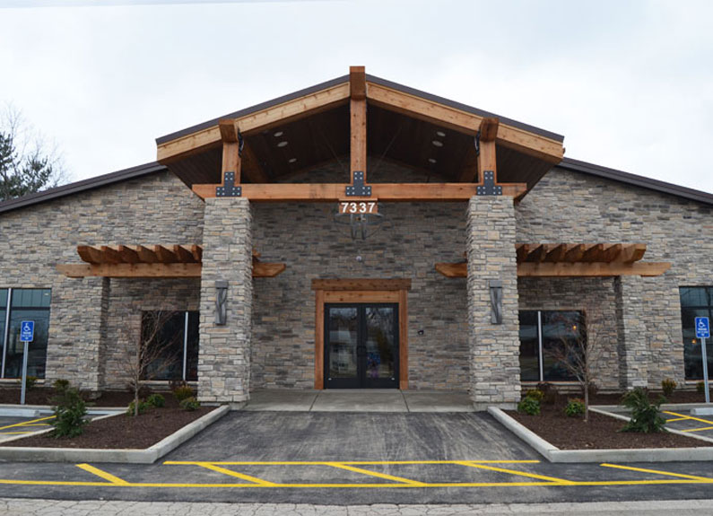 a large stone facade of a restaurant