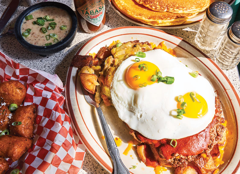 a slinger, tater tot and pancakes on a diner counter