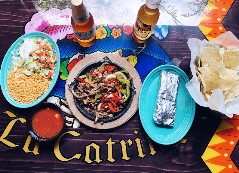 several plates of mexican food 