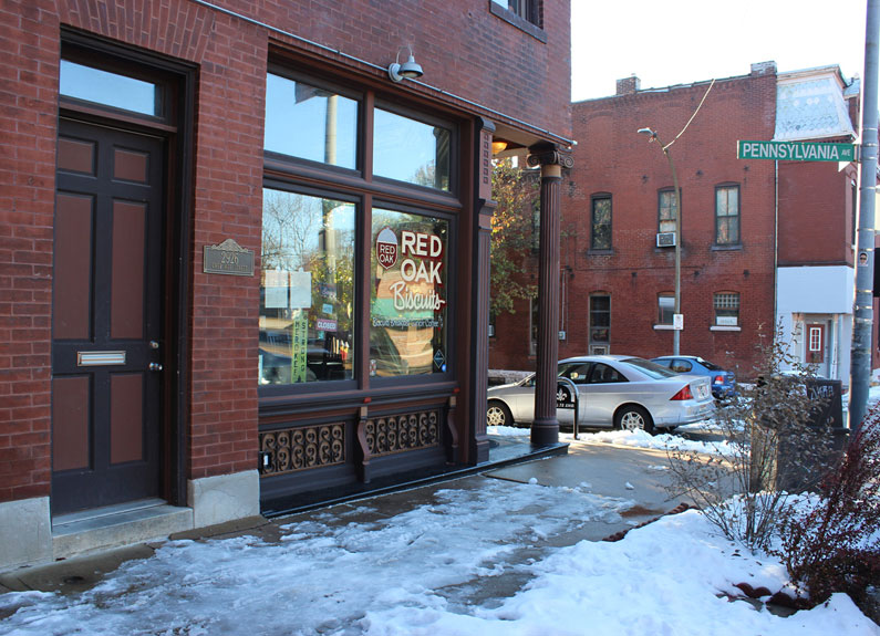 the exterior of a restaurant with snow ont he ground