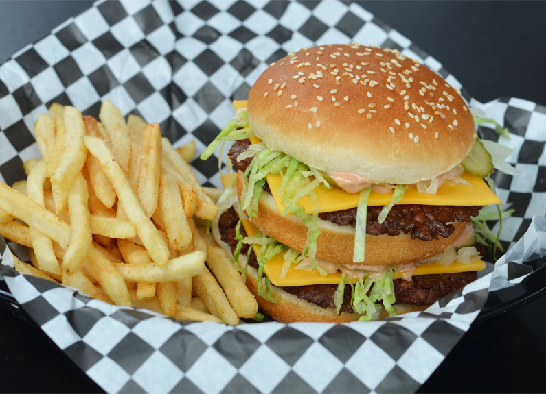 a burger and fries in a basket