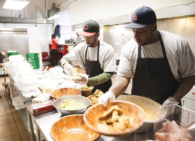 mother's best fried fish owner freddie murphy (right) and mario singleton