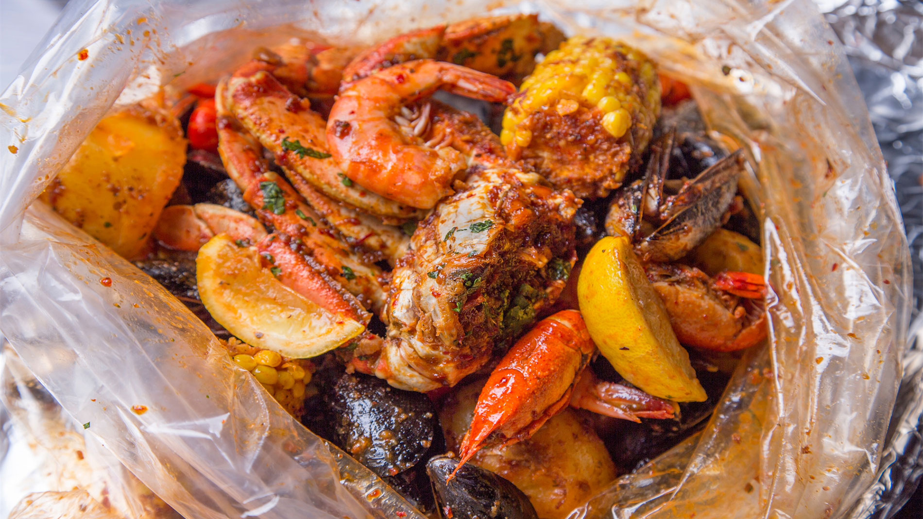 crab n go seafood boil with corn, mussels and shrimp