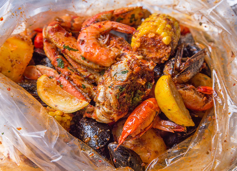 crab n go seafood boil with corn, mussels and shrimp