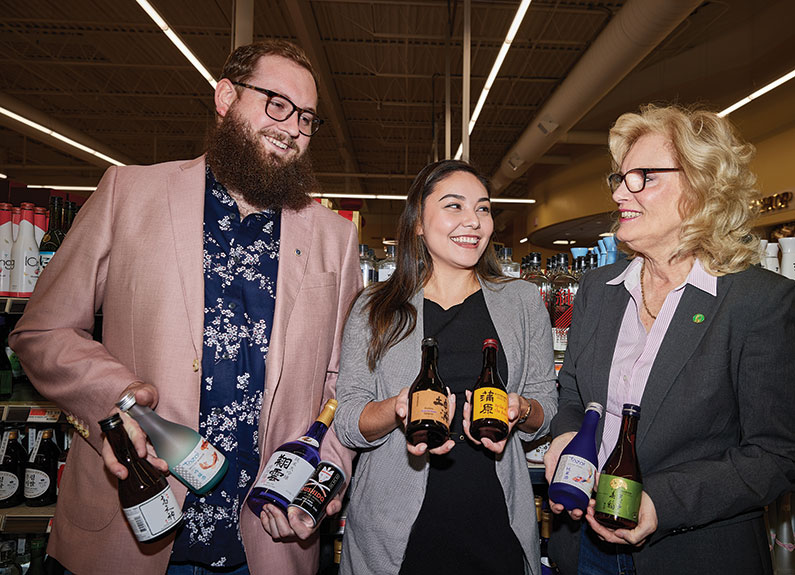 from left: andrew lamb, kira webster and patricia wamhoff shop for sake at pan-asia supermarket