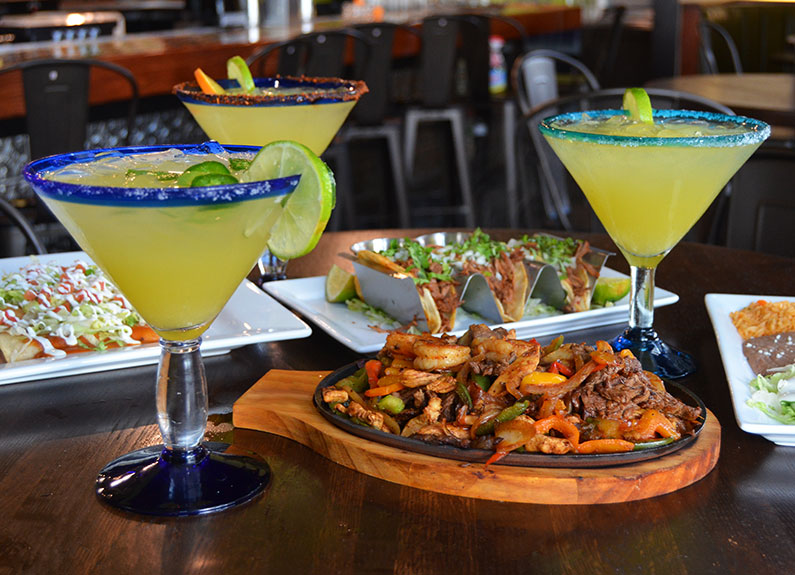 a selection of dishes and drinks at sal y limón in brentwood