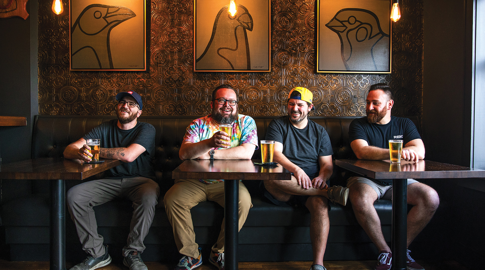 jonathan moxey (center) enjoys a beer at the golden hoosier in south city st. louis
