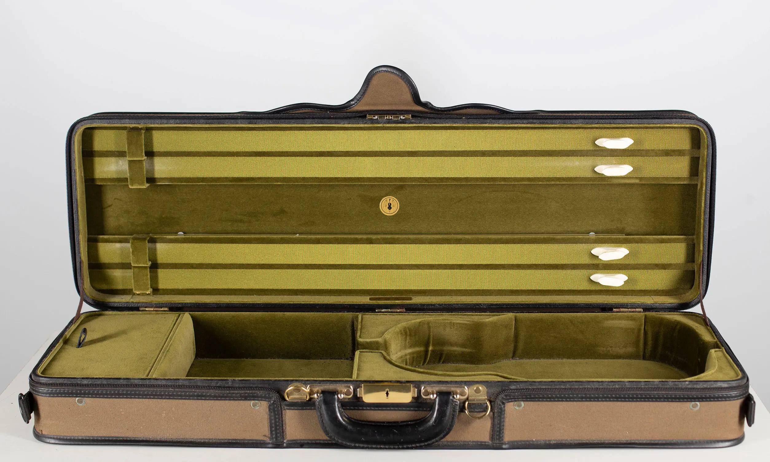 A violin case, labelled M.A Gordge