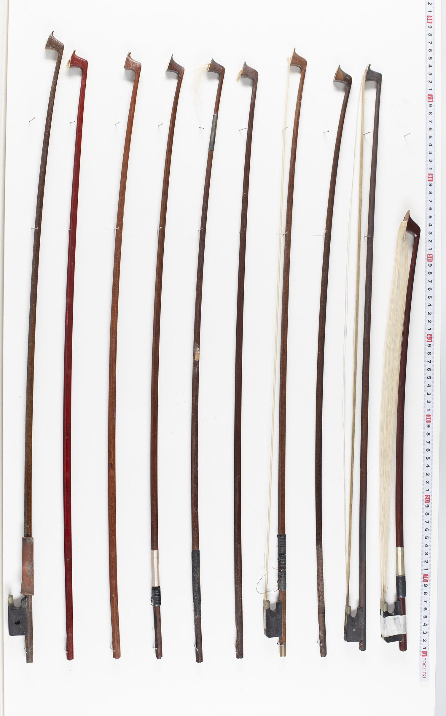 Six violin bows, one cello bow and nine sticks, various lengths