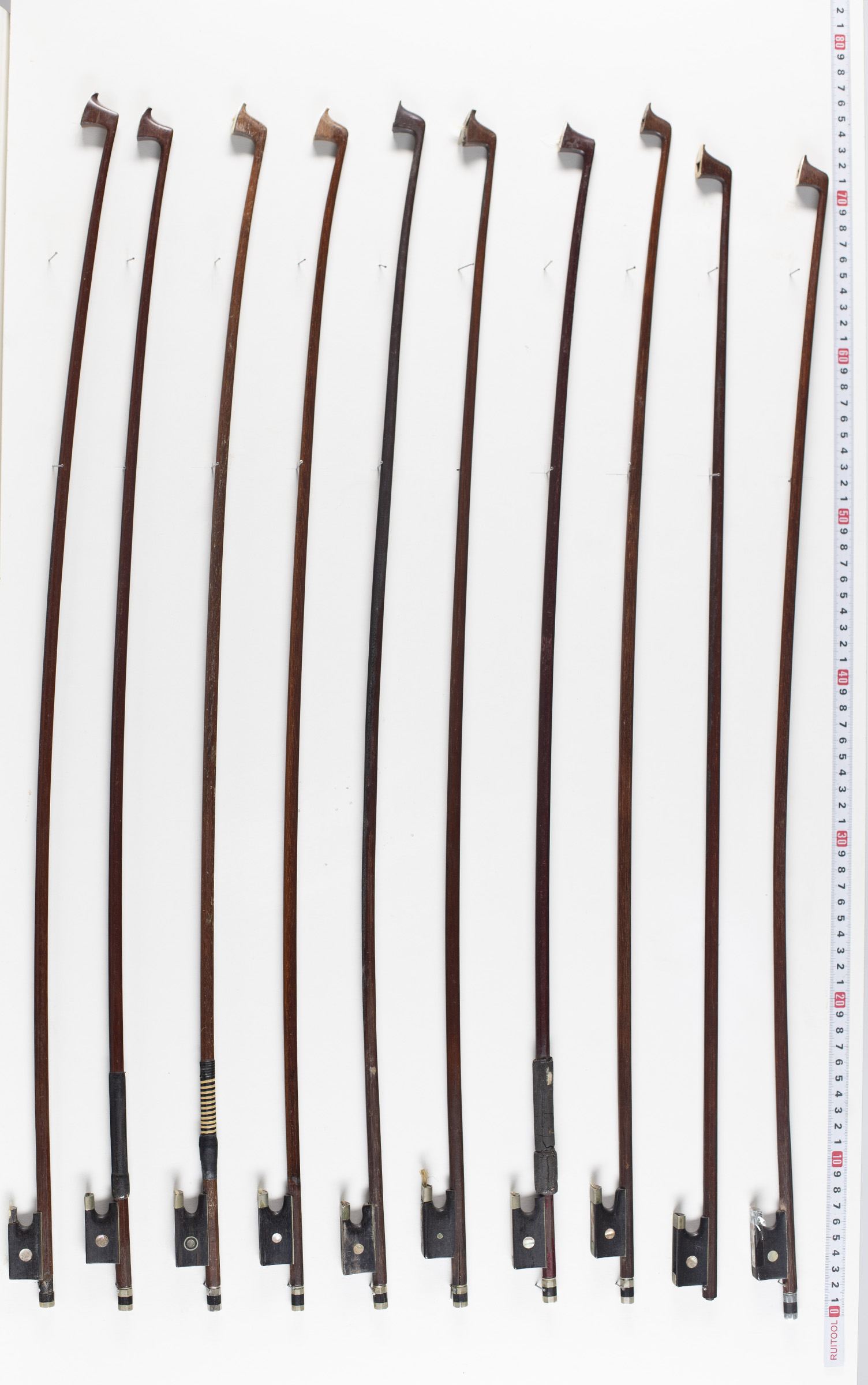 Ten violin bows, various lengths