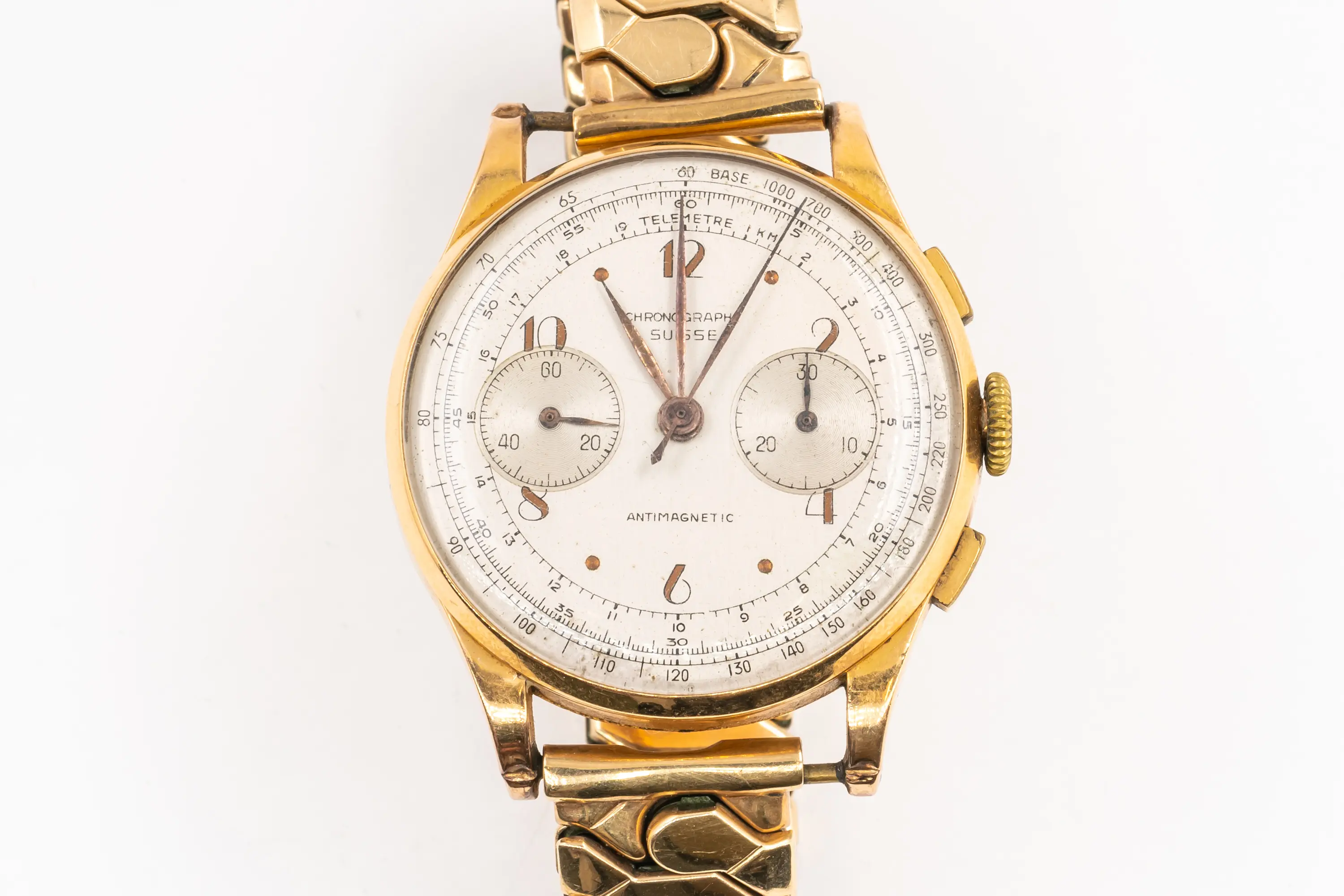 A CHRONOGRAPH SUISSE GOLD WATCH