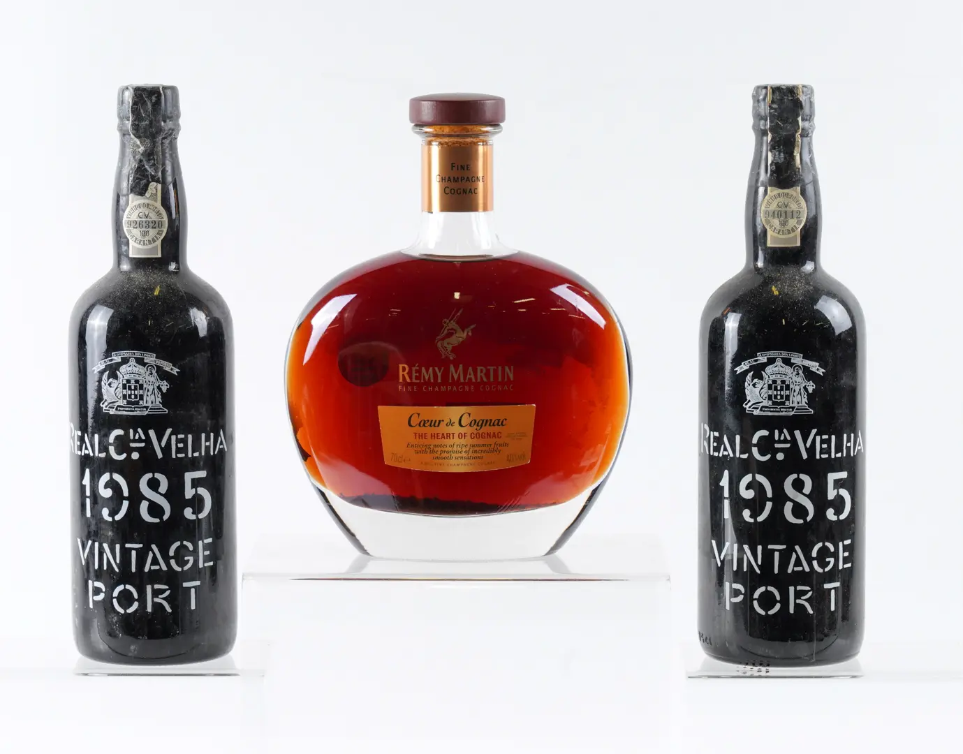 TWO BOTTLES OF REAL COMPANHIA VELHA VINTAGE 1985 PORT AND A BOTTLE OF REMY MARTIN COGNAC (3)