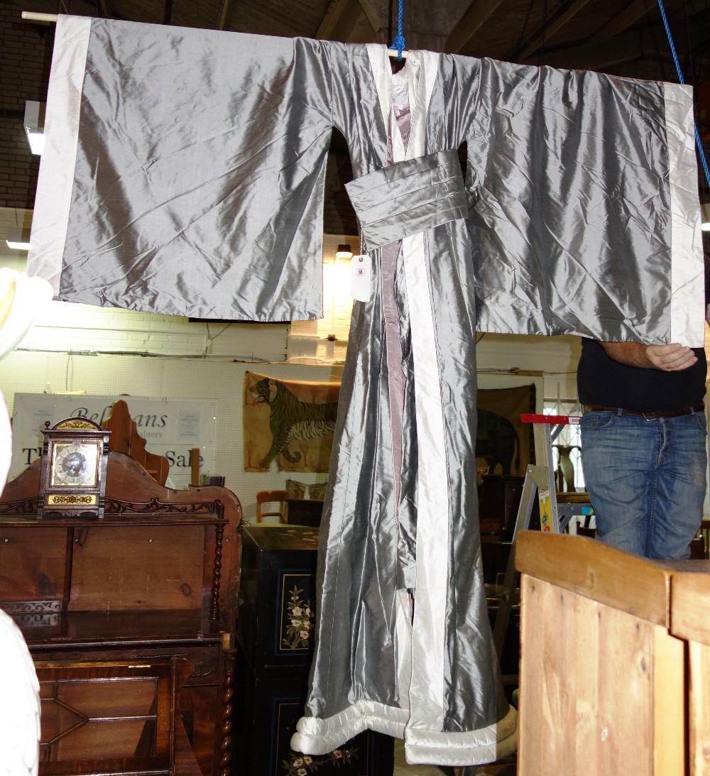 A large silver silk robe.