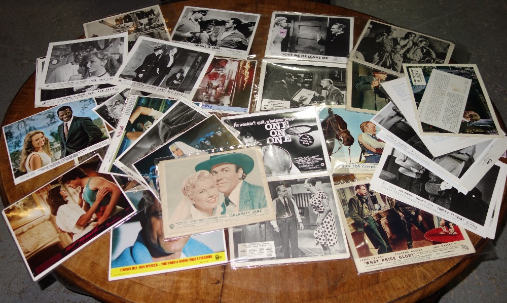 A large quantity of assorted lobby cards, including 'Love Me Or Leave Me', 'Sahara', 'Fast Forward', and 'Swing Shift'.  CAB
