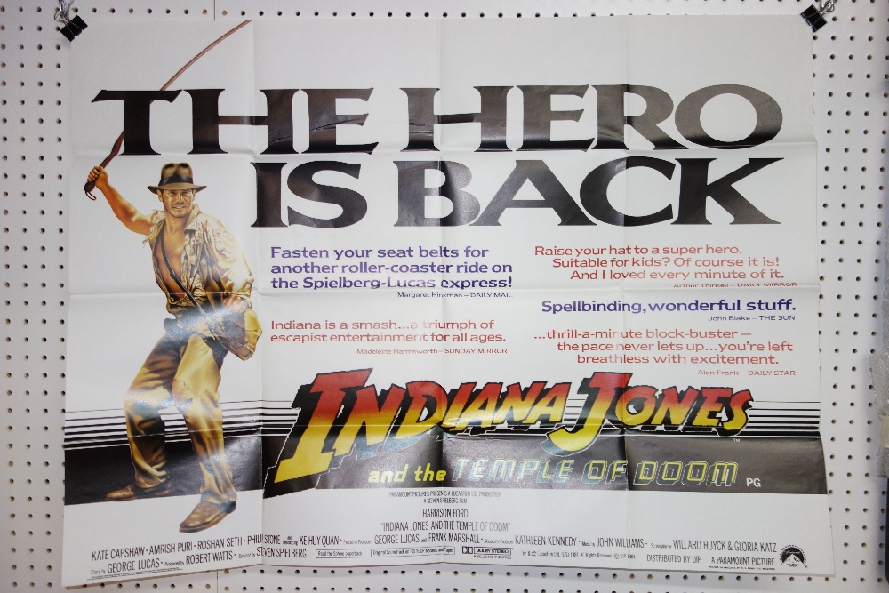 Film posters 'Indiana Jones and The Temple of Doom', (two copies) together with a group of lobby cards.